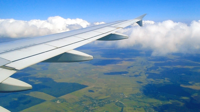 Jet plane flying over rural land