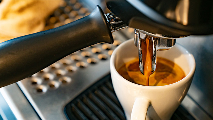 Specialty coffee being brewed on an espresso machine